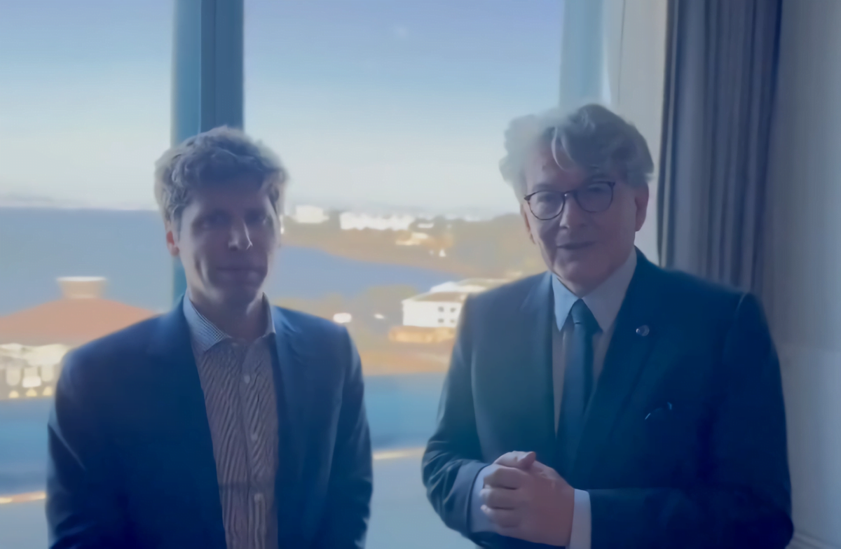 Sam Altman left and Thierry Breton right. In the background you can see a big window and the sea.