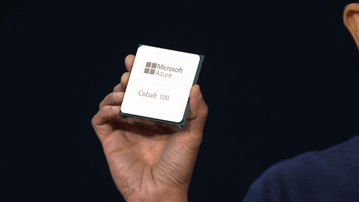 Microsoft CEO Satya Nadella holding a Microsoft AI chip in the camera.