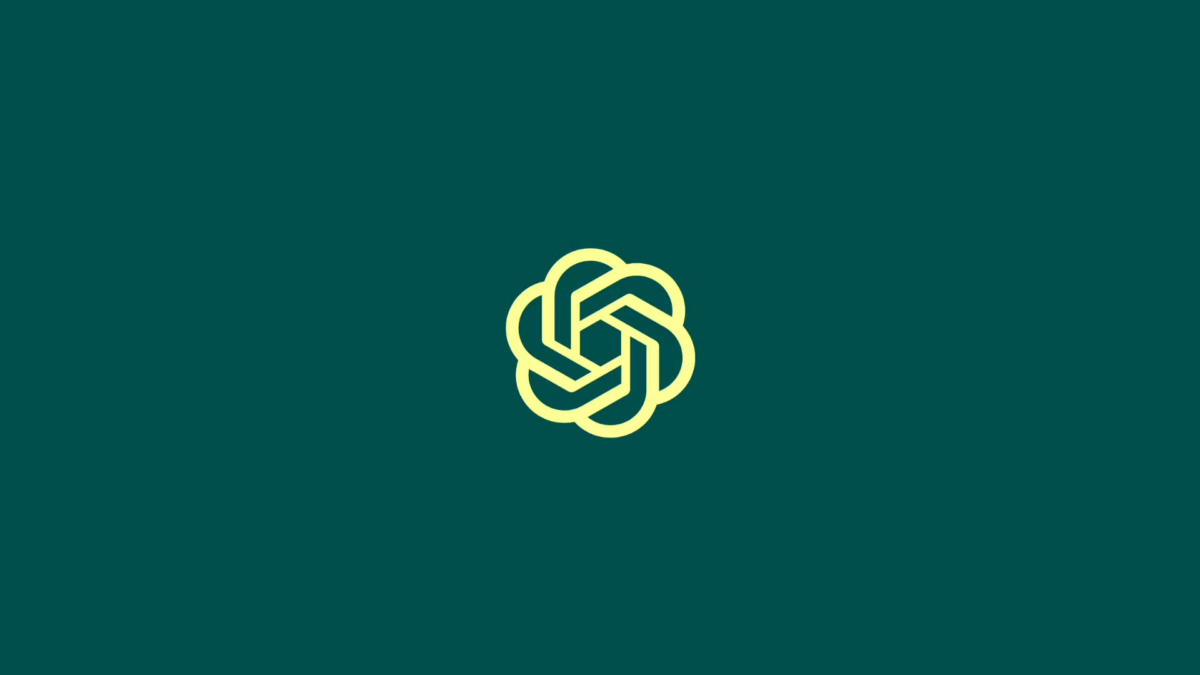 Open AI logo against green backdrop.