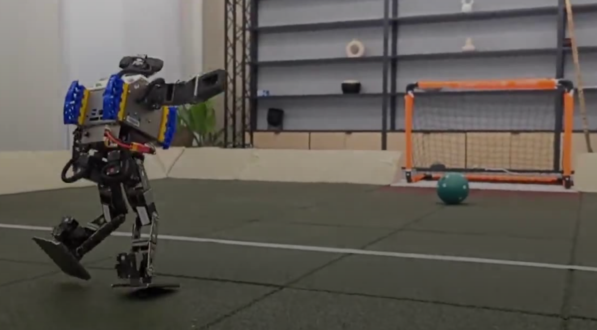 A robot takes a shot on goal, photography