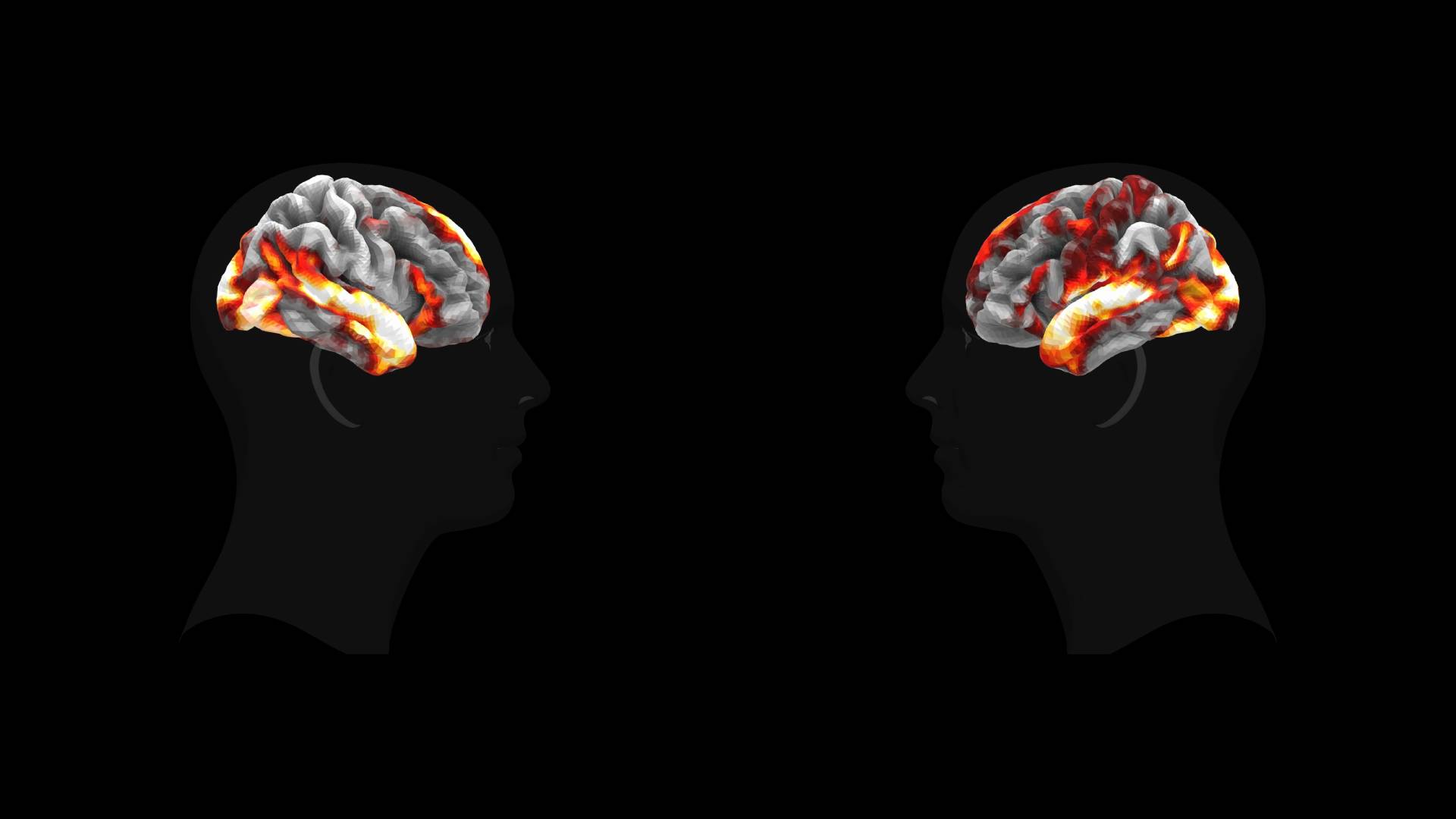 Two black head profiles with color-coded AI predictions of brain activation, red-orange heat areas on grey model.
